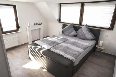 Ein Bett oder Betten in einem Zimmer der Unterkunft Ferienwohnung Traumblick