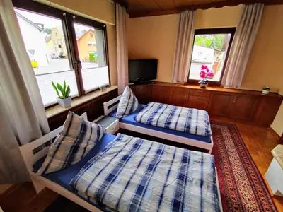 Ein Bett oder Betten in einem Zimmer der Unterkunft Ferienwohnung Maria Laach 3
