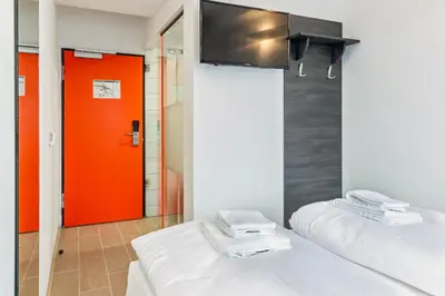 Ein Bett oder Betten in einem Zimmer der Unterkunft Augustus Hotel Bernkastel - Comfortable Budget Hotel