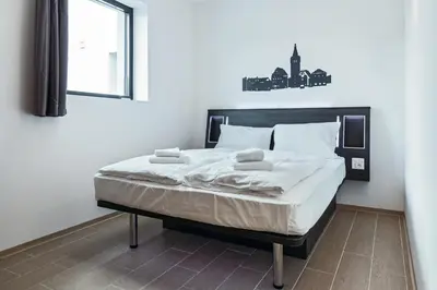 Ein Bett oder Betten in einem Zimmer der Unterkunft Augustus Hotel Bernkastel - Comfortable Budget Hotel