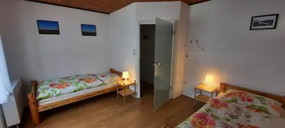 Ein Bett oder Betten in einem Zimmer der Unterkunft Ferienhaus Johanna
