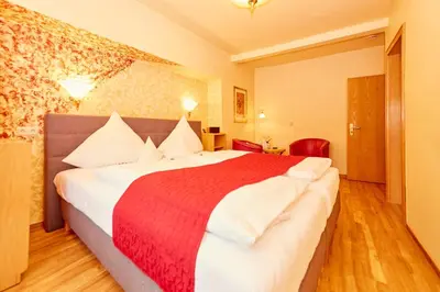 Ein Bett oder Betten in einem Zimmer der Unterkunft Gasthaus Burkard