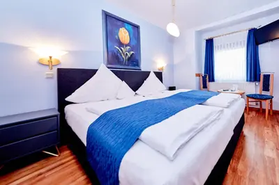 Ein Bett oder Betten in einem Zimmer der Unterkunft Gasthaus Burkard
