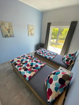 Ein Bett oder Betten in einem Zimmer der Unterkunft Ferienwohnungen Eifelausblick