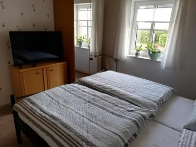 Ein Bett oder Betten in einem Zimmer der Unterkunft Ferienwohnung Eifelgold Esch