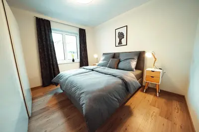 Ein Bett oder Betten in einem Zimmer der Unterkunft Ferienwohnungen schulerundmeyer