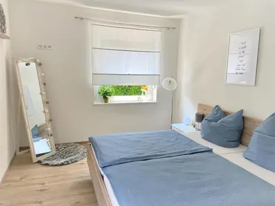 Ein Bett oder Betten in einem Zimmer der Unterkunft Ferienwohnung Flur 34