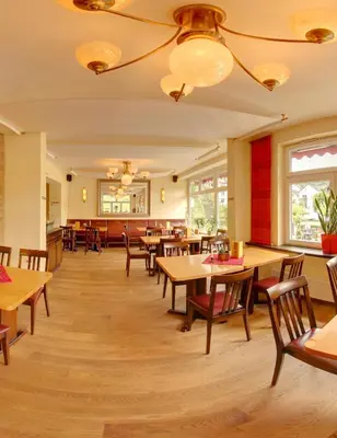 Ein Restaurant oder anderes Speiselokal in der Unterkunft Stumbergers Hotel - free parking -