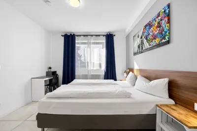 Ein Bett oder Betten in einem Zimmer der Unterkunft JUNIPRO Apartments Bostalsee