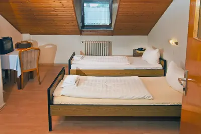 Ein Bett oder Betten in einem Zimmer der Unterkunft Hotel Kugel