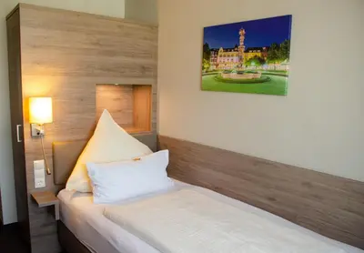 Ein Bett oder Betten in einem Zimmer der Unterkunft Hotel Morjan