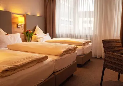 Ein Bett oder Betten in einem Zimmer der Unterkunft Hotel Morjan