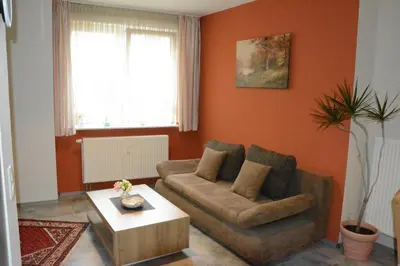 Ein Sitzbereich in der Unterkunft Ferienwohnung Goethe