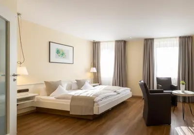 Ein Bett oder Betten in einem Zimmer der Unterkunft Hotel Deutscher Hof