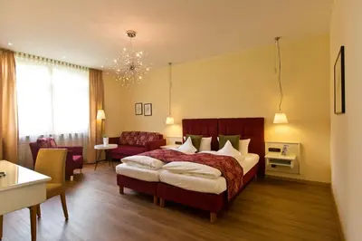 Ein Bett oder Betten in einem Zimmer der Unterkunft Hotel Deutscher Hof