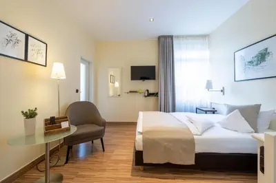 Ein Bett oder Betten in einem Zimmer der Unterkunft Hotel Deutscher Hof