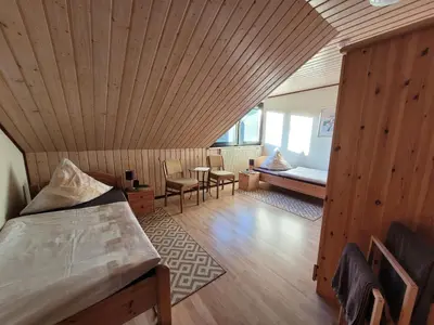 Ein Bett oder Betten in einem Zimmer der Unterkunft Eifelferienhaus Thome