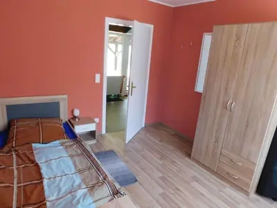 Ein Bett oder Betten in einem Zimmer der Unterkunft FeWo Kailbachtal