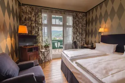 Ein Bett oder Betten in einem Zimmer der Unterkunft Romantik Jugendstilhotel Bellevue