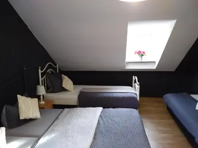Ein Bett oder Betten in einem Zimmer der Unterkunft Pension Breidbach