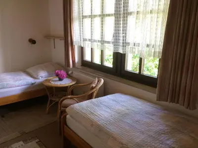 Ein Bett oder Betten in einem Zimmer der Unterkunft Haus am Wald - Urlaub am Nationalpark