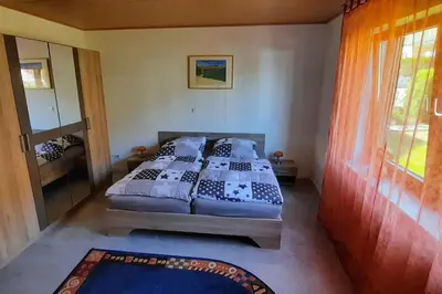 Ein Bett oder Betten in einem Zimmer der Unterkunft Ferienwohnung Bausenbergblick
