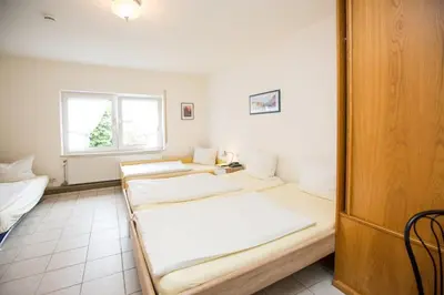 Ein Bett oder Betten in einem Zimmer der Unterkunft Hotel Pizzeria VENEZIA