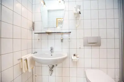 Ein Badezimmer in der Unterkunft Hotel Pizzeria VENEZIA