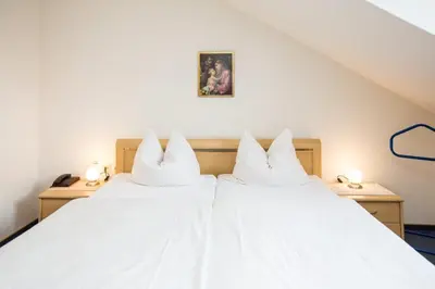 Ein Bett oder Betten in einem Zimmer der Unterkunft Hotel Pizzeria VENEZIA