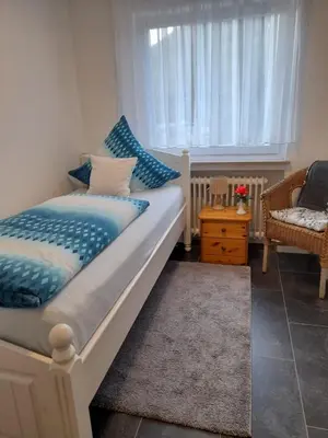 Ein Bett oder Betten in einem Zimmer der Unterkunft Ferienwohnung Ida