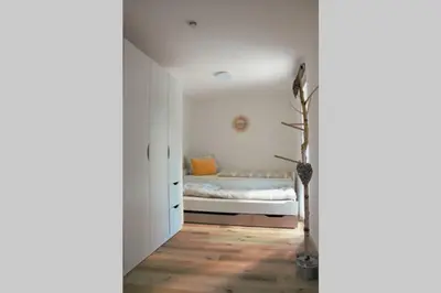 Ein Bett oder Betten in einem Zimmer der Unterkunft Cosy Home Lorch, das Ferienhaus zwischen Rheingau, Taunus und dem Tal der Loreley