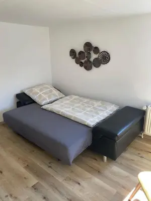 Ein Bett oder Betten in einem Zimmer der Unterkunft Cosy Home Lorch, das Ferienhaus zwischen Rheingau, Taunus und dem Tal der Loreley