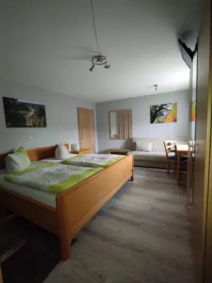 Ein Bett oder Betten in einem Zimmer der Unterkunft Gaststätte Marktstübchen