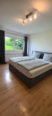 Ein Bett oder Betten in einem Zimmer der Unterkunft FeWo Sonnenlay - Apartments an der Mosel