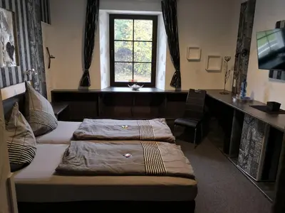 Ein Bett oder Betten in einem Zimmer der Unterkunft Waldgasthaus am Schwarzenbruch