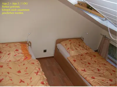 Ein Bett oder Betten in einem Zimmer der Unterkunft Järgen Ferienappartements