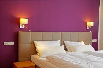 Ein Bett oder Betten in einem Zimmer der Unterkunft Hotel Eifelstube