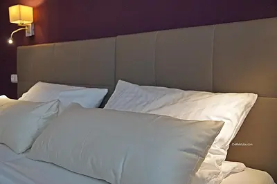 Ein Bett oder Betten in einem Zimmer der Unterkunft Hotel Eifelstube