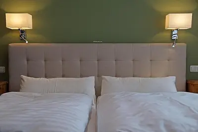 Ein Bett oder Betten in einem Zimmer der Unterkunft Hotel Eifelstube
