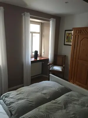 Ein Bett oder Betten in einem Zimmer der Unterkunft Ferienwohnung Rabennest