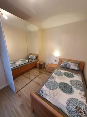 Ein Bett oder Betten in einem Zimmer der Unterkunft Haus Monika