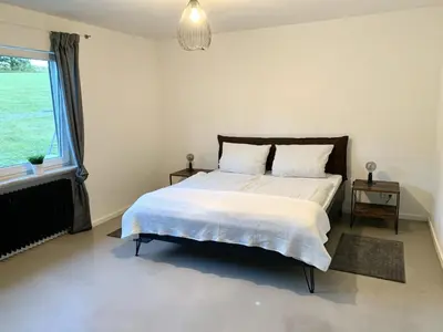 Ein Bett oder Betten in einem Zimmer der Unterkunft Zweite Heimat Nürburg