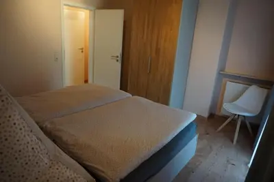 Ein Bett oder Betten in einem Zimmer der Unterkunft Weingut Göbel-Schausten