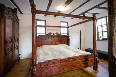 Ein Bett oder Betten in einem Zimmer der Unterkunft Rißbacher Hof anno 1737