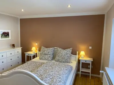 Ein Bett oder Betten in einem Zimmer der Unterkunft Ferienwohnung SeeGlück Bostalsee