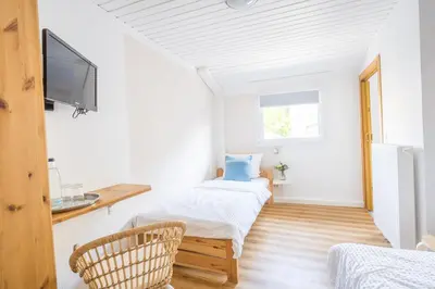 Ein Bett oder Betten in einem Zimmer der Unterkunft Pension Herheinspaziert