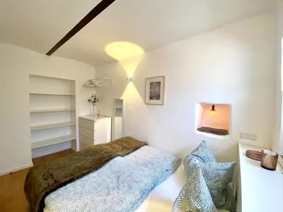Ein Bett oder Betten in einem Zimmer der Unterkunft Ferienwohnung Zur Alten Schmiede
