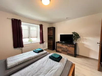 Ein Bett oder Betten in einem Zimmer der Unterkunft Apartment Nürburgblick by Interhome