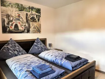 Ein Bett oder Betten in einem Zimmer der Unterkunft Apartment Nürburgblick by Interhome