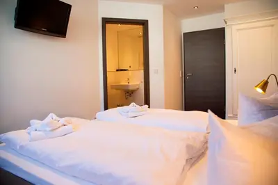 Ein Bett oder Betten in einem Zimmer der Unterkunft Hotel Zum Goldenen Stern